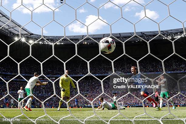 France's forward Antoine Griezmann celebrates scoring a second goal past Ireland's goalkeeper Darren Randolph during the Euro 2016 round of 16...