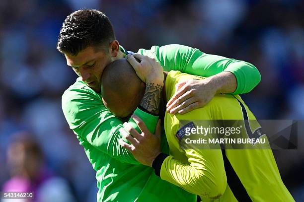 Ireland's goalkeeper Darren Randolph is comforted by Ireland's goalkeeper Keiren Westwood after the Euro 2016 round of 16 football match between...