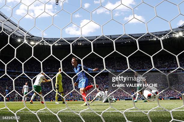 France's forward Antoine Griezmann celebrates scoring a second goal past Ireland's goalkeeper Darren Randolph during the Euro 2016 round of 16...