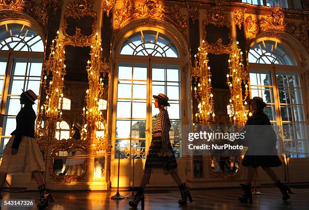 Model is a creation of a theatrical fashion show &quot;Tsarskoye Selo. Russia style&quot; designer Leonid Alexeev in the Grand Hall of the Catherine...