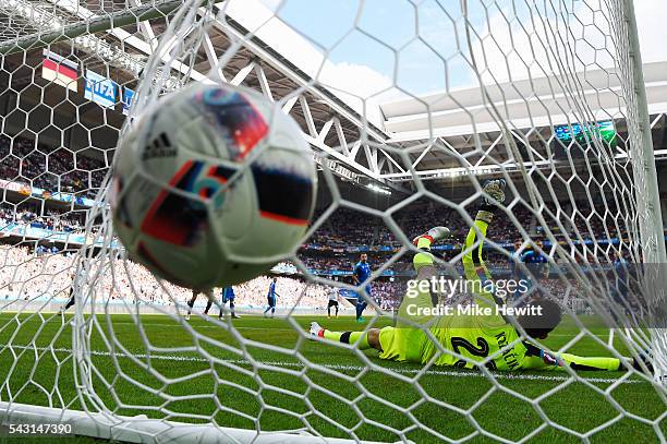 Jerome Boateng of Germany scores the opening goal past Matus Kozacik of Slovakia during the UEFA EURO 2016 round of 16 match between Germany and...