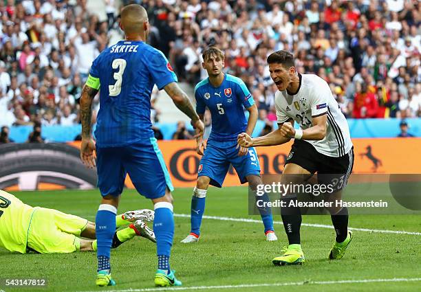 Mario Gomez of Germany celebrates scoring his team's second goal during the UEFA EURO 2016 round of 16 match between Germany and Slovakia at Stade...
