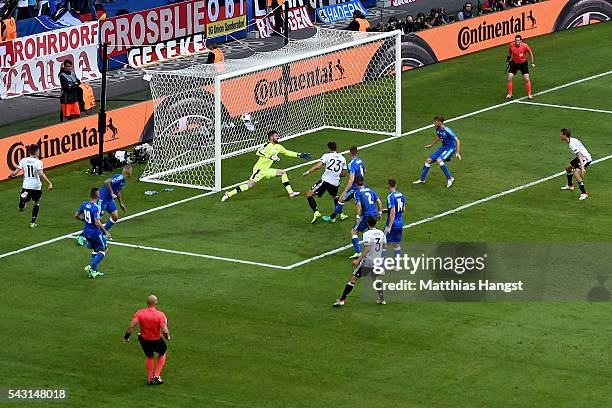 Mario Gomez of Germany scores his team's second goal past Matus Kozacik of Slovakia during the UEFA EURO 2016 round of 16 match between Germany and...