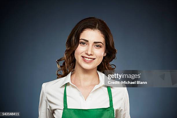 head and shoulders portrait - apron woman stock-fotos und bilder