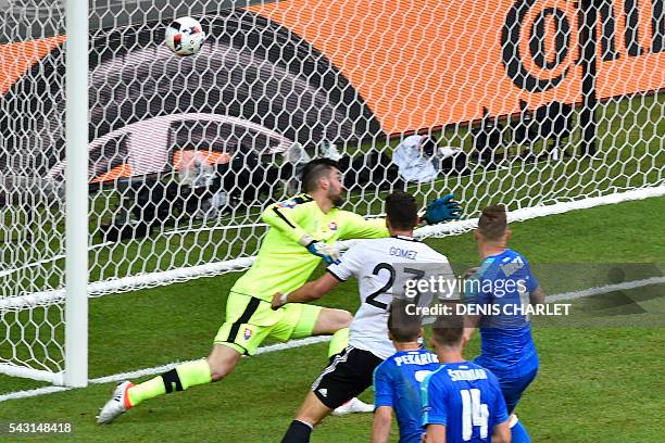 Germany's forward Mario Gomez scores against Slovakia's goalkeeper Matus Kozacik during the Euro 2016 round of 16 football match between Germany and...