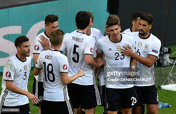 Germany's forward Mario Gomez celebrates with teammates after scoring during the Euro 2016 round of 16 football match between Germany and Slovakia at...
