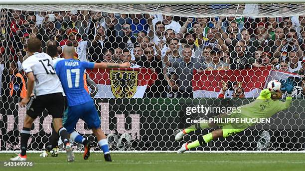 Slovakia's goalkeeper Matus Kozacik saves a penalty shot during the Euro 2016 round of 16 football match between Germany and Slovakia at the...