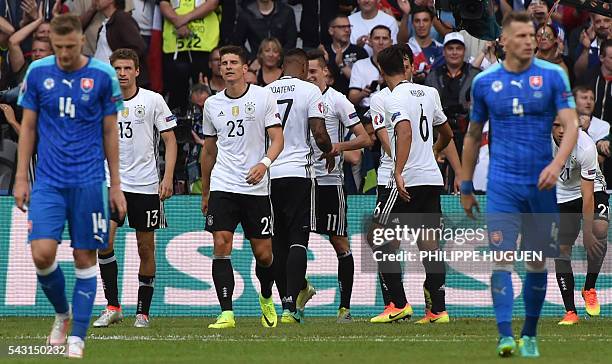 Germany's forward Mario Gomez celebrates with teammates after scoring during the Euro 2016 round of 16 football match between Germany and Slovakia at...