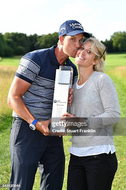 Henrik Stenson of Sweden celebrates his 3 shot victory with wife Emma and the trophy after the final round of the BMW International Open at Gut...