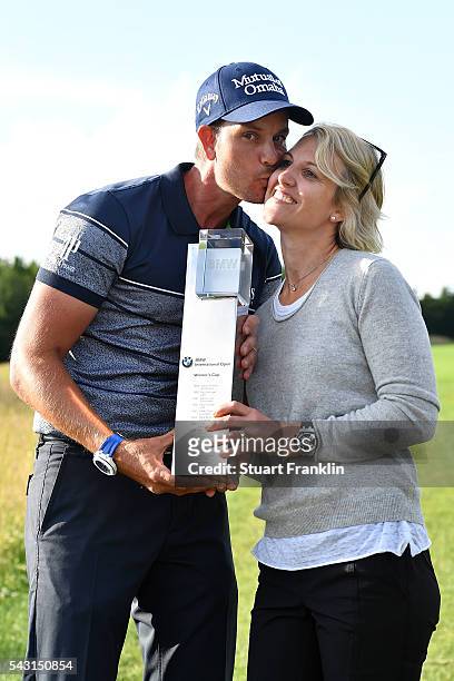 Henrik Stenson of Sweden celebrates his 3 shot victory with wife Emma and the trophy after the final round of the BMW International Open at Gut...
