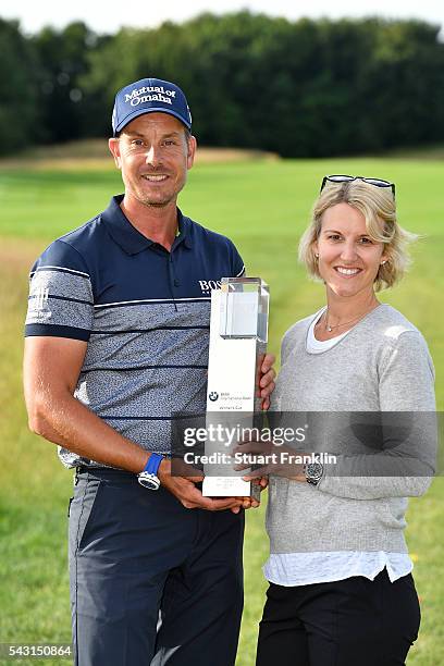 Henrik Stenson of Sweden poses with wife Emma and the trophy after the final round of the BMW International Open at Gut Larchenhof on June 26, 2016...