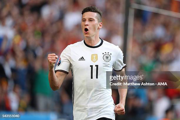 Julian Draxler of Germany celebrates scoring a goal to make the score 3-0 during the UEFA Euro 2016 Round of 16 match between Germany and Slovakia at...