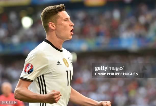 Germany's midfielder Julian Draxler celebrates after scoring during the Euro 2016 round of 16 football match between Germany and Slovakia at the...