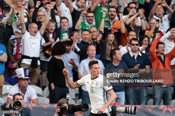 Germany's midfielder Julian Draxler celebrates after scoring his team's third goal during the Euro 2016 round of 16 football match between Germany...