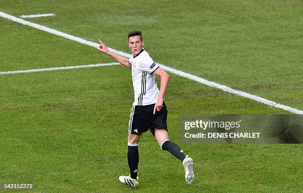 Germany's midfielder Julian Draxler celebrates after scoring during the Euro 2016 round of 16 football match between Germany and Slovakia at the...