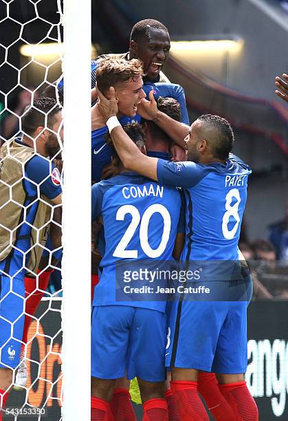 Antoine Griezmann of France celebrates his second goal with teammates during the UEFA EURO 2016 round of 16 match between France and Republic of...