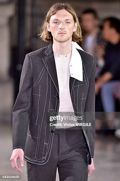 Model walks the runway during the Maison Margiela Menswear Spring/Summer 2017 show as part of Paris Fashion Week on June 24, 2016 in Paris, France.