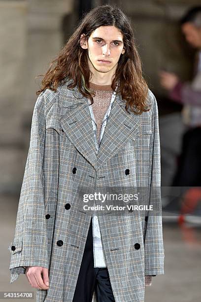 Model walks the runway during the Maison Margiela Menswear Spring/Summer 2017 show as part of Paris Fashion Week on June 24, 2016 in Paris, France.