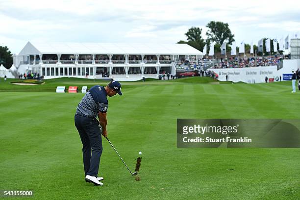 Henrik Stenson of Sweden hits his approach shot to the 18th green during the final round of the BMW International Open at Gut Larchenhof on June 26,...