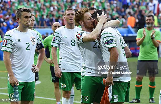 Lyon , France - 26 June 2016; Stephen Quinn consoles Shane Long of Republic of Ireland after the UEFA Euro 2016 Round of 16 match between France and...