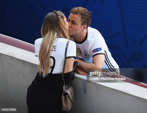 Mario Goetze of Germany kisses his girlfriend Ann-Kathrin Broemmel after the UEFA EURO 2016 round of 16 match between Germany and Slovakia at Stade...