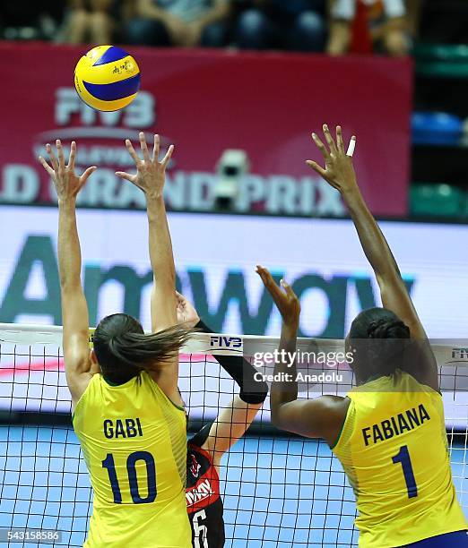 Gabriela Braga Guimaraes and Fabiana Claudino of Brazil in action during the 2016 FIVB Volleyball World Grand Prix Women's match between Turkey and...