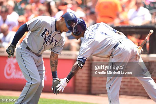 Desmond Jennings of the Tampa Bay Rays celebrates a solo home run with Tim Beckham in the second inning during a baseball game against the Baltimore...