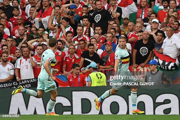 Belgium's defender Toby Alderweireld celebrates with Belgium's defender Jan Vertonghen after scoring the opening goal during the Euro 2016 round of...