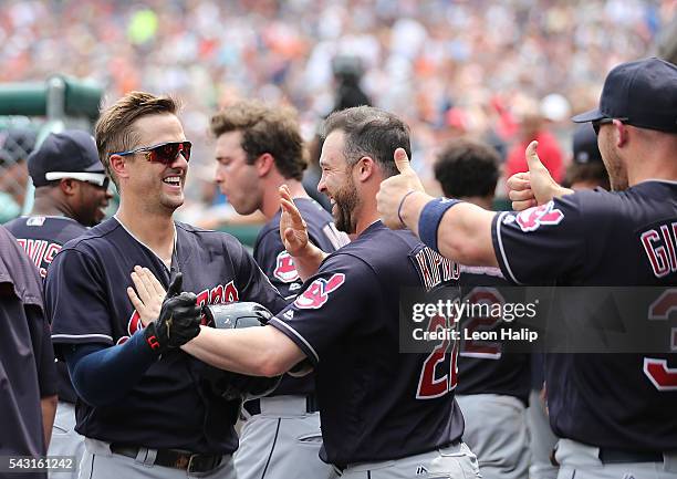Tyler Naquin and teammates Jason Kipnis and Chris Gimenez of the Cleveland Indians celebrate in the dugout during a four home run inning against the...