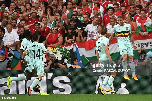 Belgium's defender Toby Alderweireld celebrates with teammates after scoring the opening goal during the Euro 2016 round of 16 football match between...