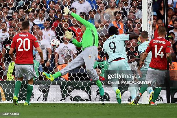 Belgium's defender Toby Alderweireld heads the ball and scores the opening goal during the Euro 2016 round of 16 football match between Hungary and...