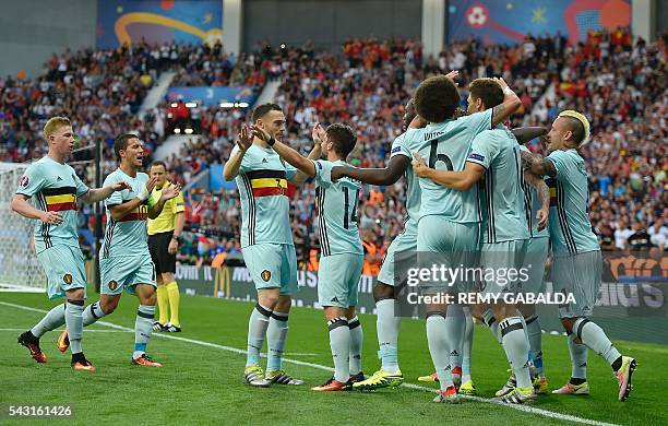 Belgium's players celebrate their opening goal during the Euro 2016 round of 16 football match between Hungary and Belgium at the Stadium Municipal...