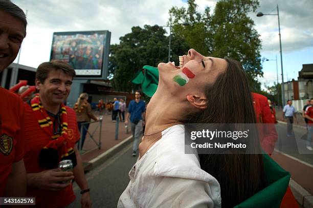 Woman from Hungary laughs in front of supporters of Belgium. Supporters from Belgium and Hungary came to Toulouse and its Municipal stadium for the...