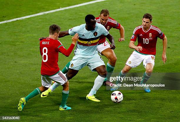 Romelu Lukaku of Belgium controls the ball under pressure of Adam Nagy , Roland Juhasz and Zoltan Gera of Hungary during the UEFA EURO 2016 round of...