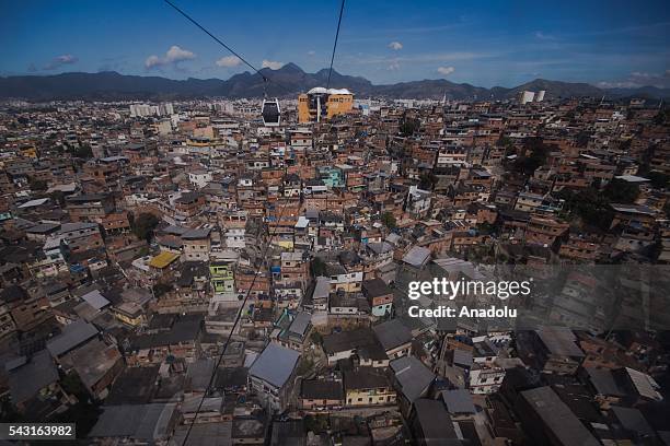 Cable car transports commuters over homes in the Alemao Complex, Morro do Alemao is seen in Rio de Janeiro, Brazil on June 26, 2016.