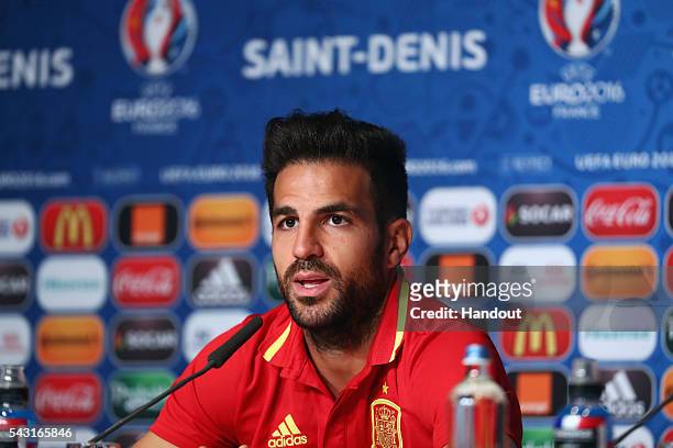In this handout image provided by UEFA Cesc Fabregas of Spain attends a press conference at Stade de France on June 26, 2016 in Paris, France.