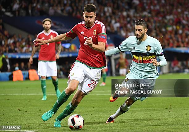 Hungary's defender Richard Guzmics vies for the ball with Belgium's forward Yannick Ferreira-Carrasco during the Euro 2016 round of 16 football match...
