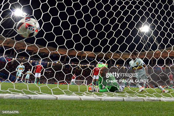 Belgium's forward Michy Batshuayi scores past Hungary's goalkeeper Gabor Kiraly during the Euro 2016 round of 16 football match between Hungary and...