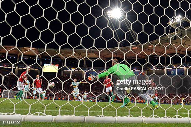 Belgium's forward Eden Hazard shoots to score his teams third goal during the Euro 2016 round of 16 football match between Hungary and Belgium at the...