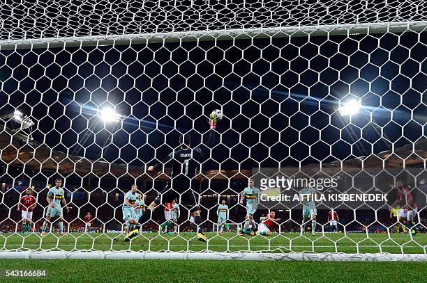 Belgium's goalkeeper Thibaut Courtois saves a shot during the Euro 2016 round of 16 football match between Hungary and Belgium at the Stadium...