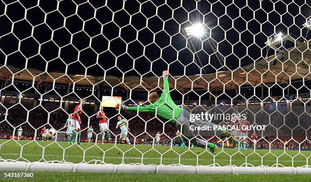 Hungary's goalkeeper Gabor Kiraly attempts to save Belgium's forward Eden Hazard third goal during the Euro 2016 round of 16 football match between...