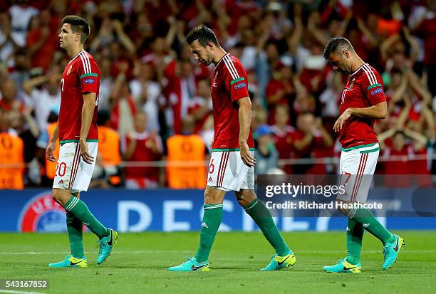 Richard Guzmics, Akos Elek and Nemanja Nikolic of Hungary show their dejection after their 0-4 defeat in the UEFA EURO 2016 round of 16 match between...