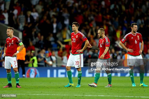 Balazs Dzsudzsak, Richard Guzmics, Gergo Lovrencsics and Akos Elek of Hungary show their dejection after their 0-4 defeat in the UEFA EURO 2016 round...