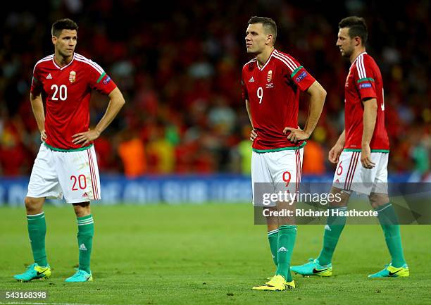 Richard Guzmics, Adam Szalai and Akos Elek of Hungary show their dejection after their 0-4 defeat in the UEFA EURO 2016 round of 16 match between...