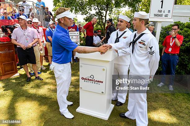 Billy Hurley III greets members of the Armed Forces on the first hole tee box during the final round of the Quicken Loans National at Congressional...