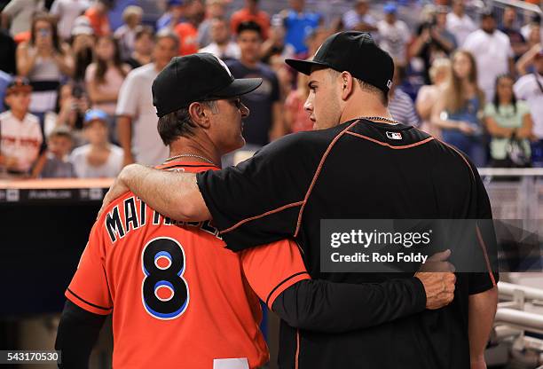 Manager Don Mattingly walks with his arm around Jose Fernandez of the Miami Marlins after the game against the Chicago Cubs at Marlins Park on June...