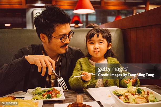 dad & daughter enjoying meal in restaurant - asians eating bildbanksfoton och bilder