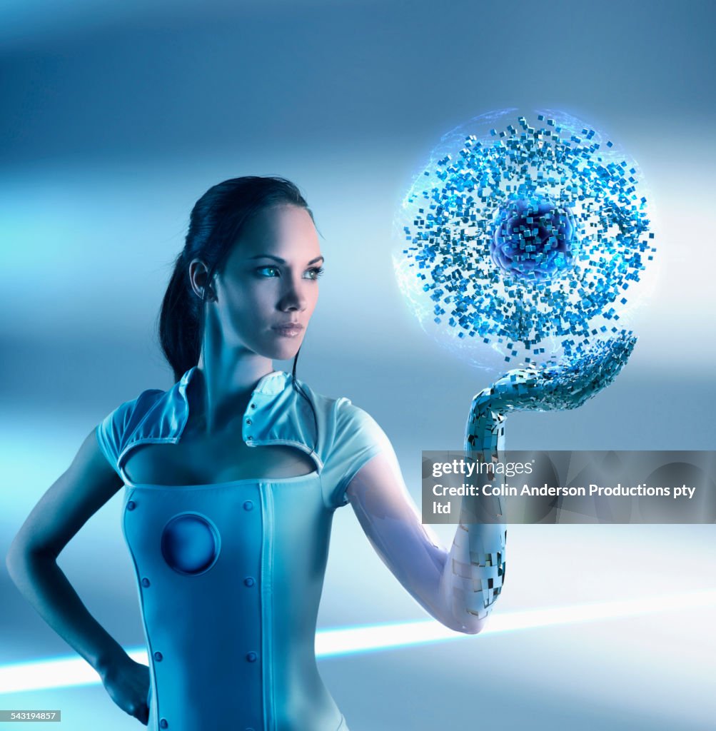 Pacific Islander woman holding glowing particle orb