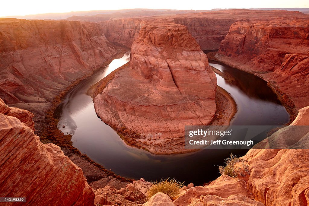 Horse shoe bend in river near majestic rock formations in desert landscape, Page, Arizona, United States