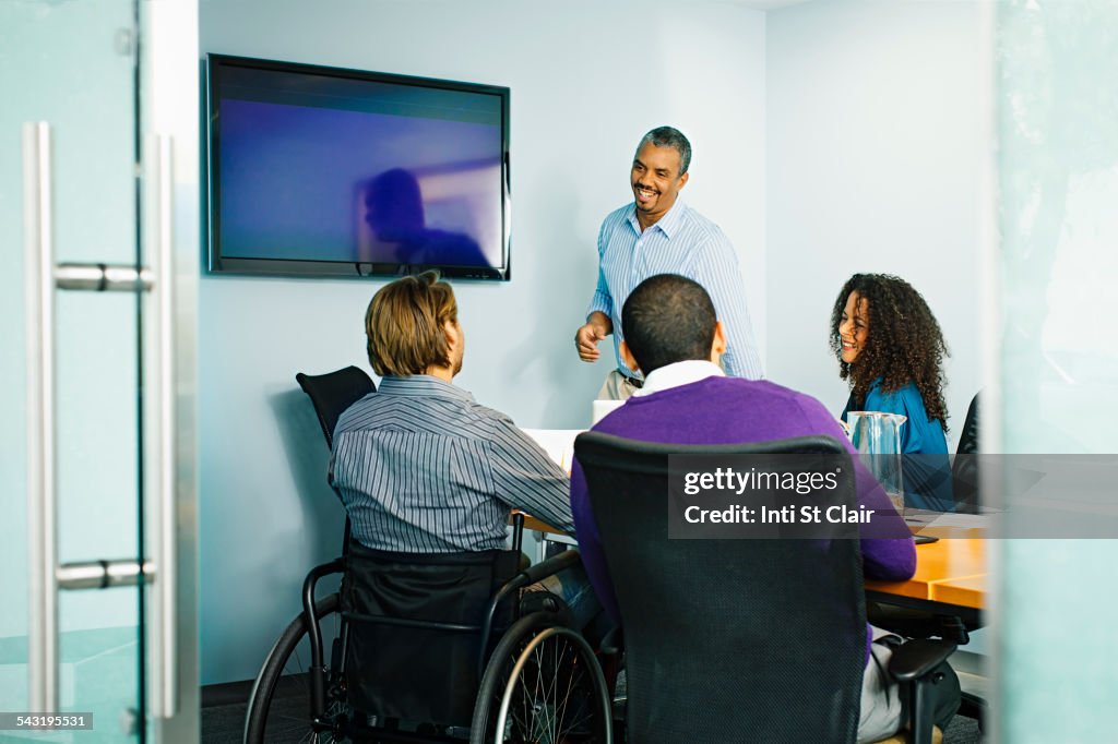 Business people talking in office meeting